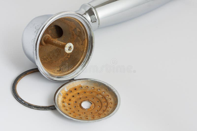 Broken shower head with limescale and rust on it. royalty free stock photos