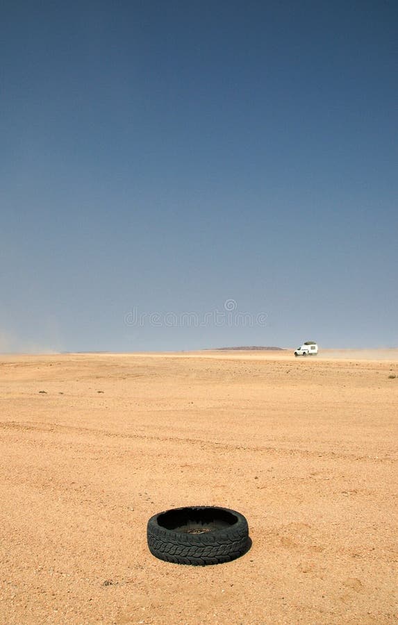 Broken tire in endless desert