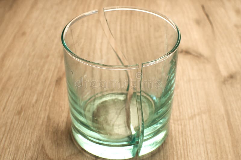 https://thumbs.dreamstime.com/b/broken-transparent-glass-cup-two-symmetrical-parts-closeup-broken-glass-cup-109045514.jpg