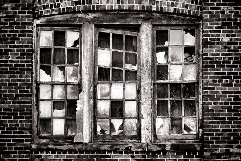 Broken Window on Old Abandoned Industrial Building