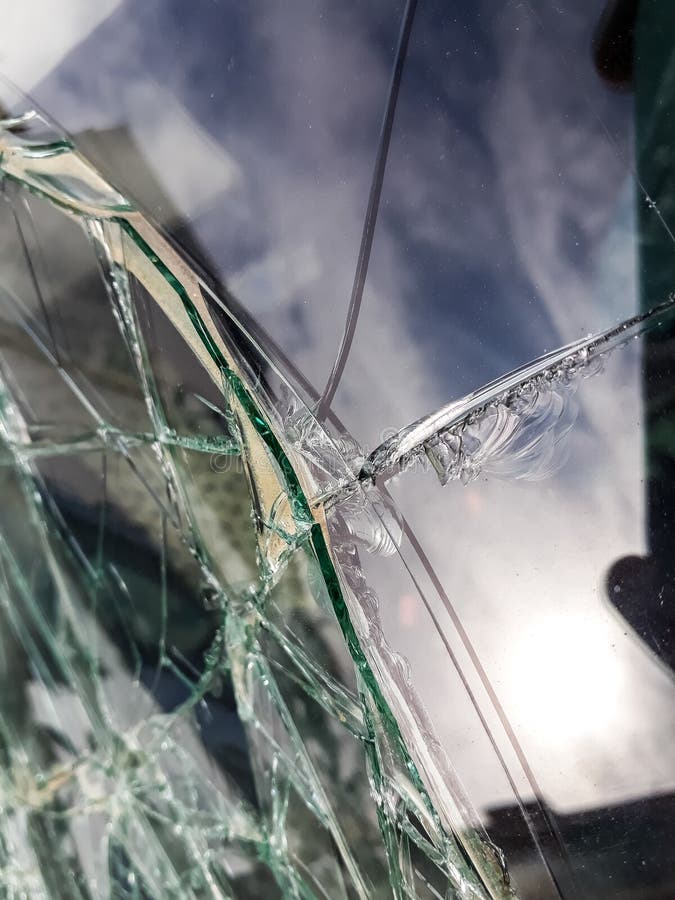 Broken Windshield of Abandoned and Destroyed Car, with Broken Glass