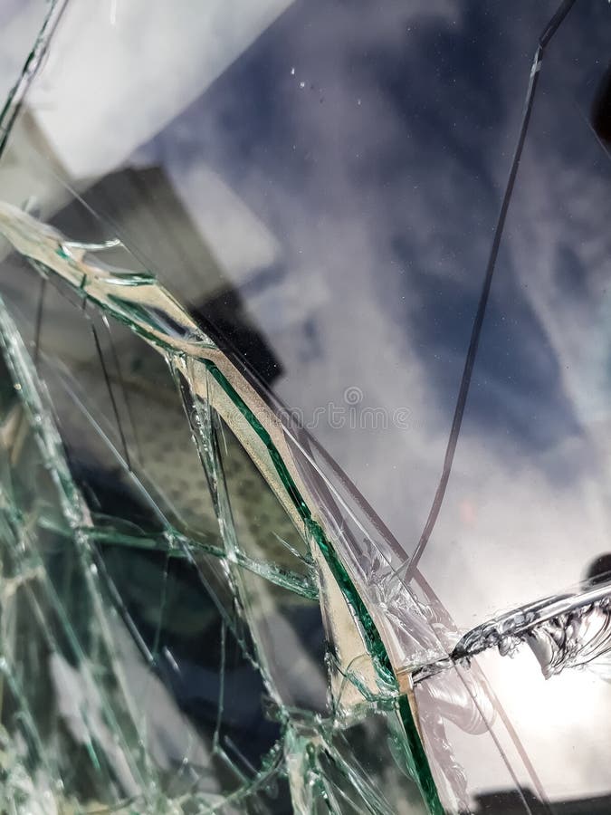 Broken Windshield of Abandoned and Destroyed Car, with Broken Glass