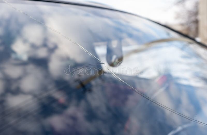 Broken Windshield with Big Crack through the Glass, Damaged Car Stock