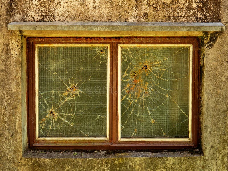 Broken Wire Mesh Glass Window on Concrete Wall Front View Stock Photo