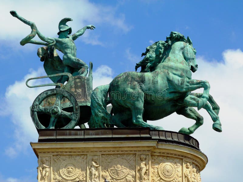 Bronze statue of chariot and man with snake at the Heroes` square in Budapest. the symbol of war.