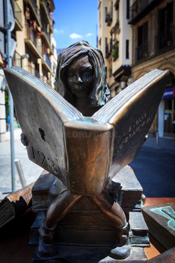 Bronze Statue Of Girl Sitting On Books  Reading Editorial 