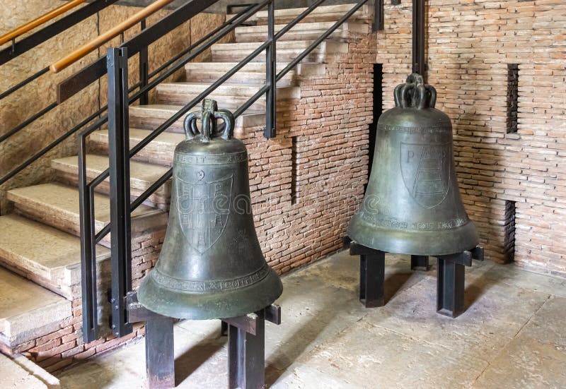 Verona, Italy - September 26, 2015 : Bronze bells at the exhibition at the exhibition in the Castelvecchio Museum of the Castelvecchio Castello Scaligero fortress in Verona, Italy. Verona, Italy - September 26, 2015 : Bronze bells at the exhibition at the exhibition in the Castelvecchio Museum of the Castelvecchio Castello Scaligero fortress in Verona, Italy