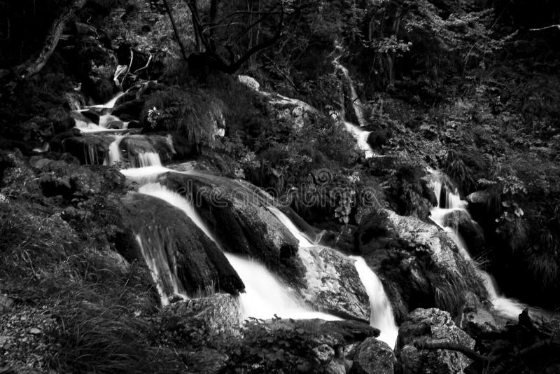 Brook waterfall at Zompo Lo Schioppo. Nature reserve in Abruzzo, Italy. Ideal place to walk in the middle of nature with children and with your dog stock image Brook waterfall at Zompo Lo Schioppo. Nature reserve in Abruzzo, Italy. Ideal place to walk in the middle of nature with children and with your dog stock image