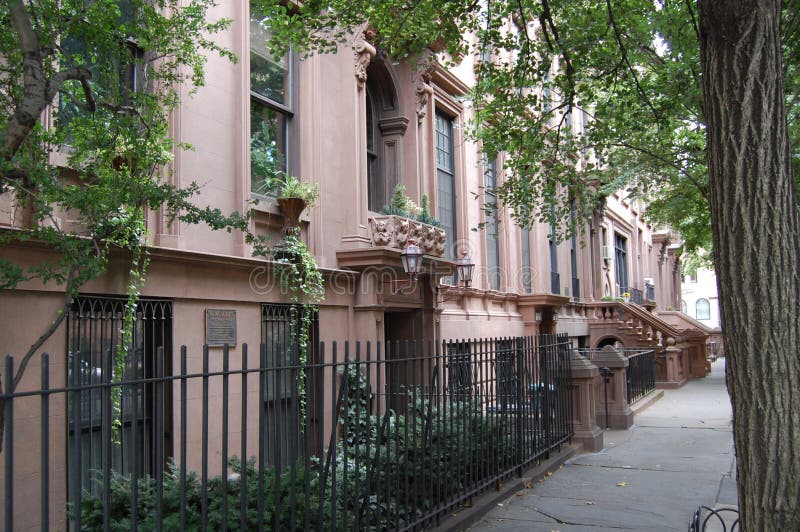 A row of brownstone homes in the old landmark neighborhood of Brooklyn Heights in New York City. A row of brownstone homes in the old landmark neighborhood of Brooklyn Heights in New York City.