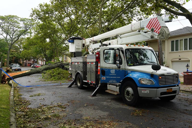 BROOKLYN, NEW YORK - AUGUST 6, 2020: Con Edison repair crew restores power and clears street the aftermath of severe weather as tropical storm Isaias hits New York City