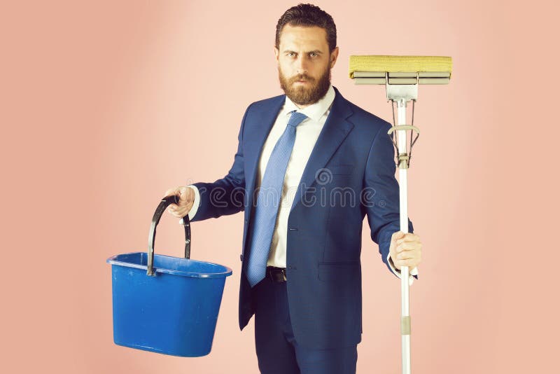 Broom and bucket in hand of bearded man or businessman stock images Broom and bucket in hand of bearded man or businessman stock images
