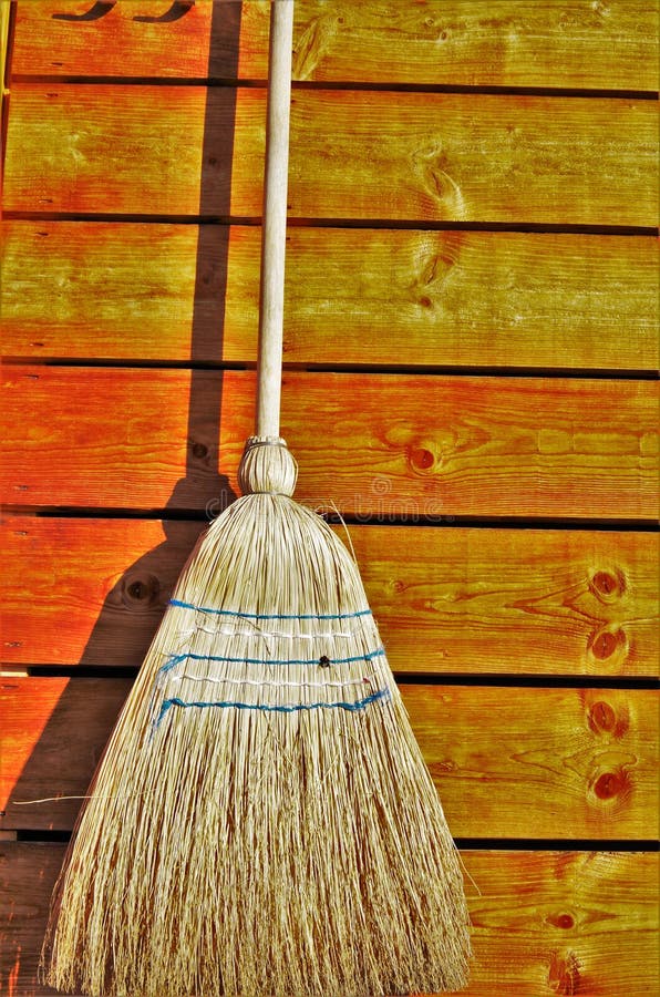 Broom hanging on the wall stock image. Image of color 53300101