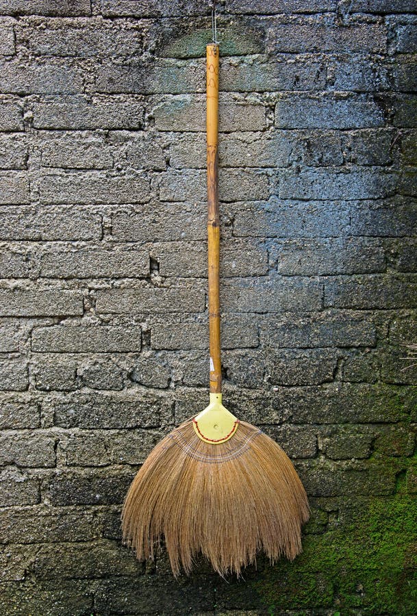 Broom hanging on the wall stock image. Image of color 53300101