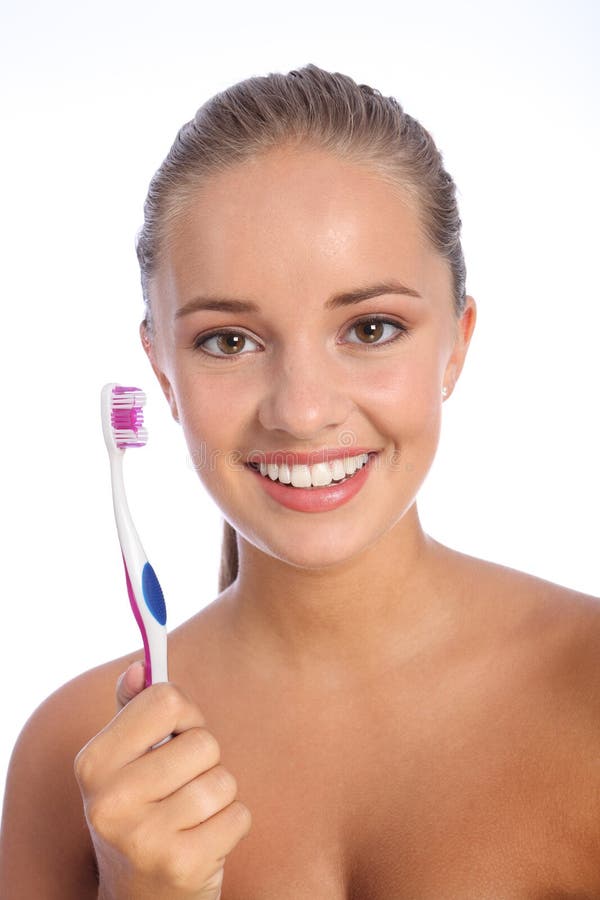 Brosse à dents de soin dentaire pour le grand sourire de jeune femme image stock Brosse à dents de soin dentaire pour le grand sourire de jeune femme image stock