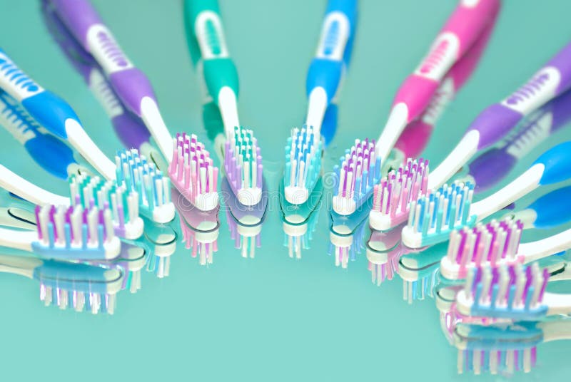 Toothbrushes in water drops with reflections. Toothbrushes in water drops with reflections