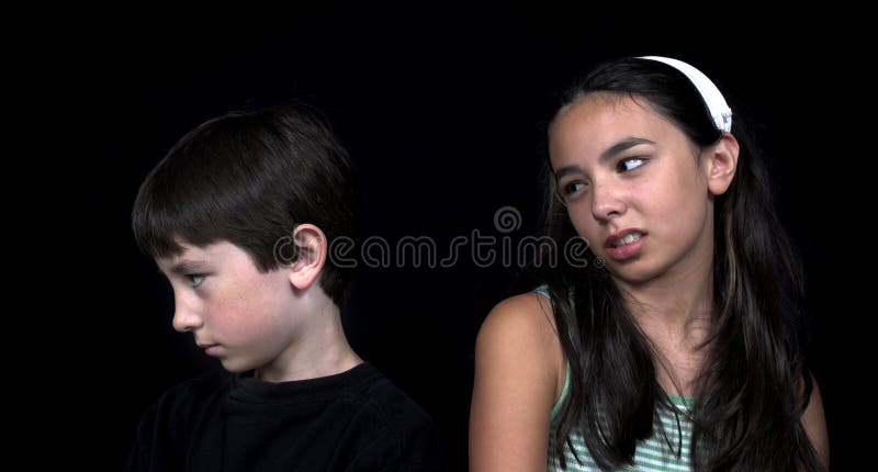 Brother and sister arguing over black background