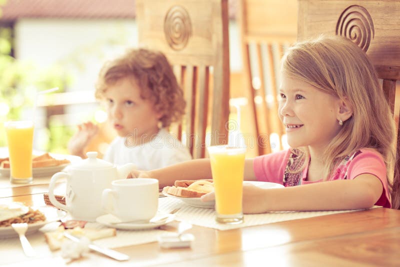 Cute Brother And Sister Having Breakfast Stock Image 