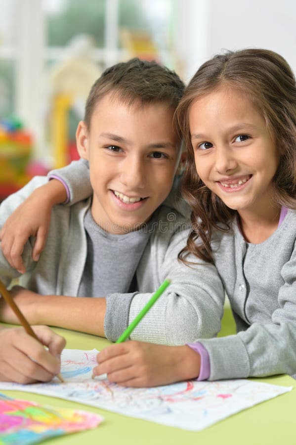 Brother and sister drawing stock photo. Image of cute - 80791032