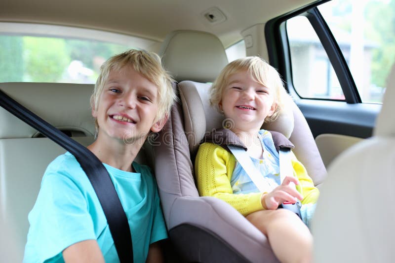 Brother and sister enjoying trip in the car royalty free stock photo Brother and sister enjoying trip in the car royalty free stock photo
