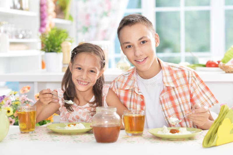 Cute Brother And Sister Having Breakfast Stock Image 