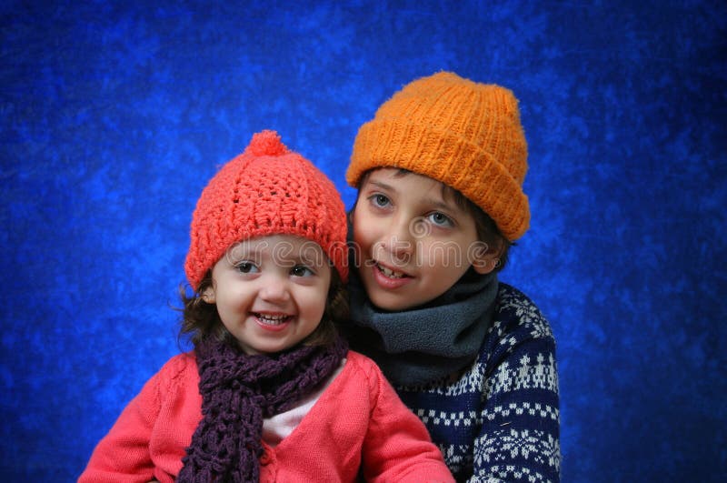 Brother and sister having fun in winter