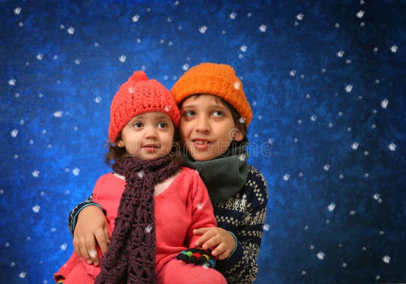 Brother and sister having fun in winter