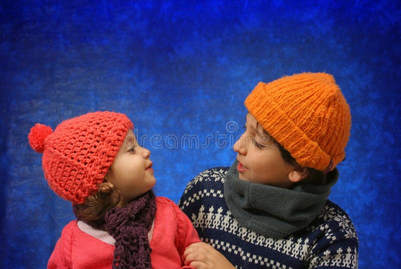 Brother and sister having fun in winter