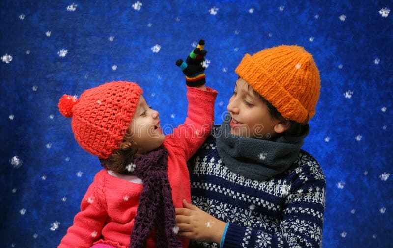 Brother and sister having fun in winter