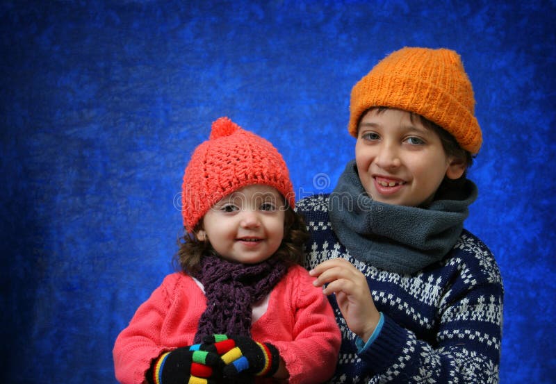 Brother and sister having fun in winter