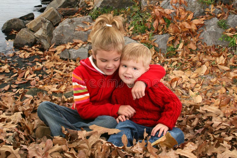 Brother and Sister Hugging at the Park