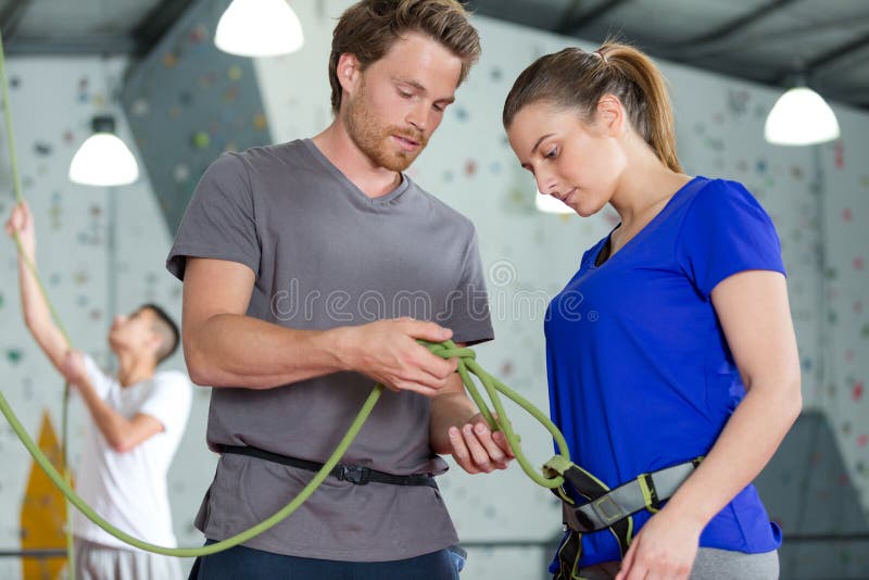 Brother and sister near rock wall for climbing indoor royalty free stock image Brother and sister near rock wall for climbing indoor royalty free stock image