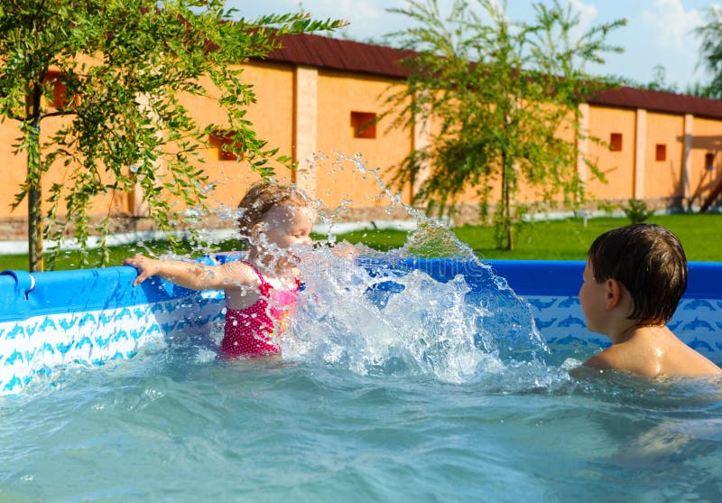 Brother Sister Swim Play In Pool Stock Photo - Image of 