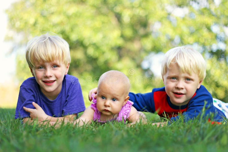 Brothers and Baby Sisters Relaxing Outside Stock Image - Image of ...
