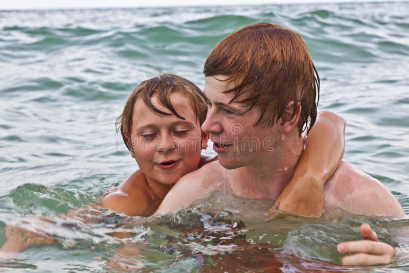 Brothers having fun in the ocean