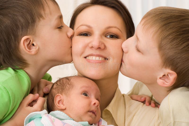 Brothers kissing mom