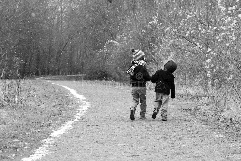 Two Brothers Holding Hands in the Wheat Fields Stock Photo - Image of ...