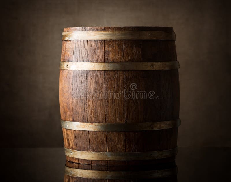 Old wooden barrel on a brown background. Old wooden barrel on a brown background