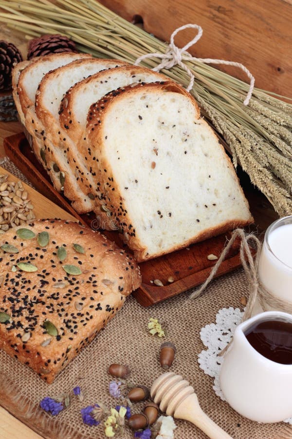 Brown Bread with Whole Grain Cereals of Sliced and Milk. Stock Photo