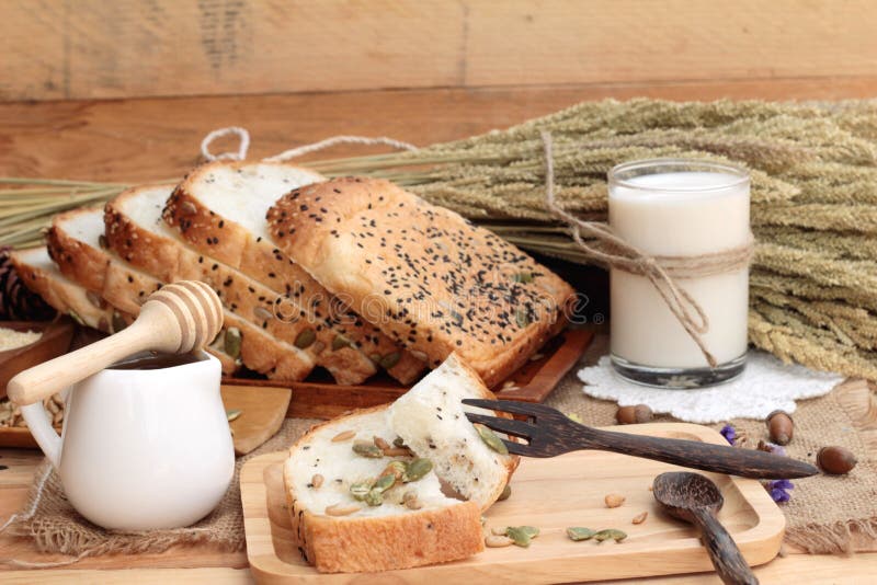 Brown Bread with Whole Grain Cereals of Sliced and Milk. Stock Photo