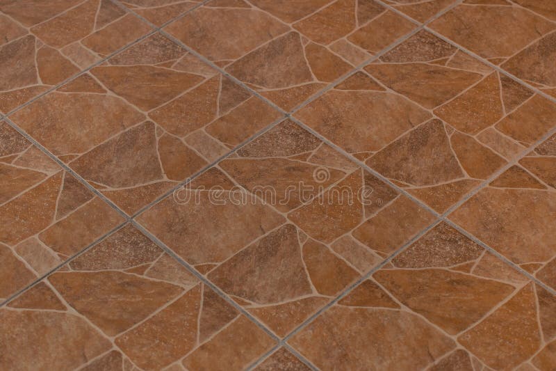Brown Ceramic Stone Floor Tile Abstract Pattern Surface Texture Background royalty free stock photo