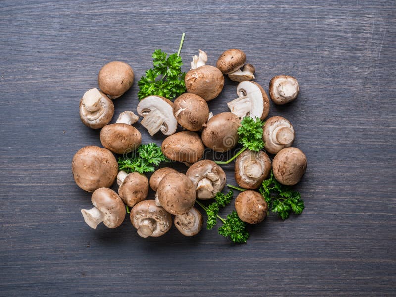 Brown Colored Edible Mushrooms or Cremini Mushrooms on Black Table with