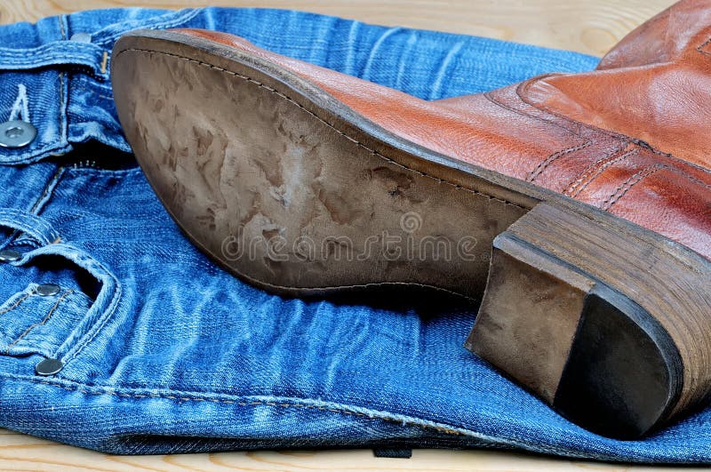 Leather Brown Cowboy Boots and Belt on Blue Jeans Stock Photo Image