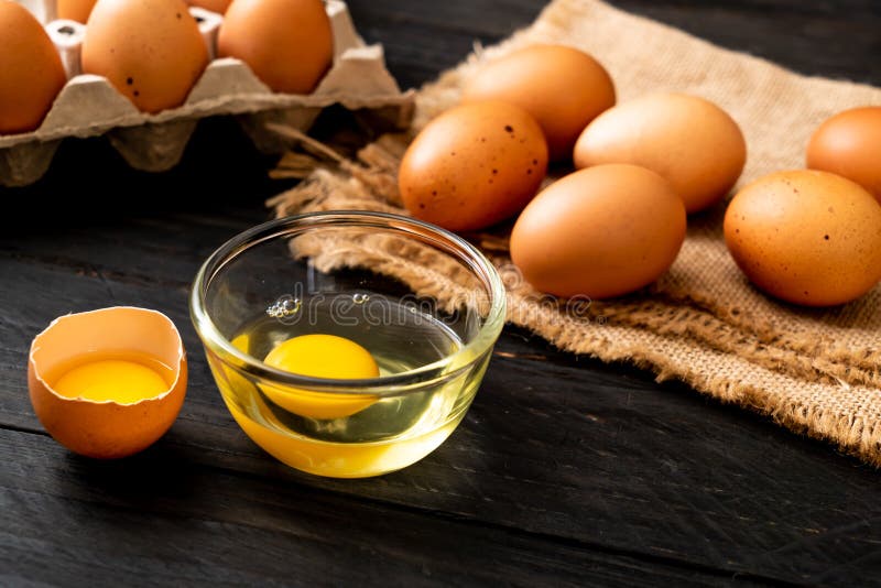 Brown Eggs with One Broken and Egg Yolk Stock Photo Image of organic