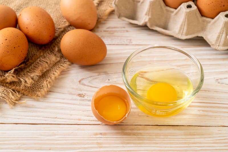 Brown Eggs With One Broken And Egg Yolk Stock Photo Image of shell