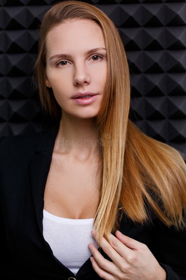 Brown-eyed woman in black jacket royalty free stock photography