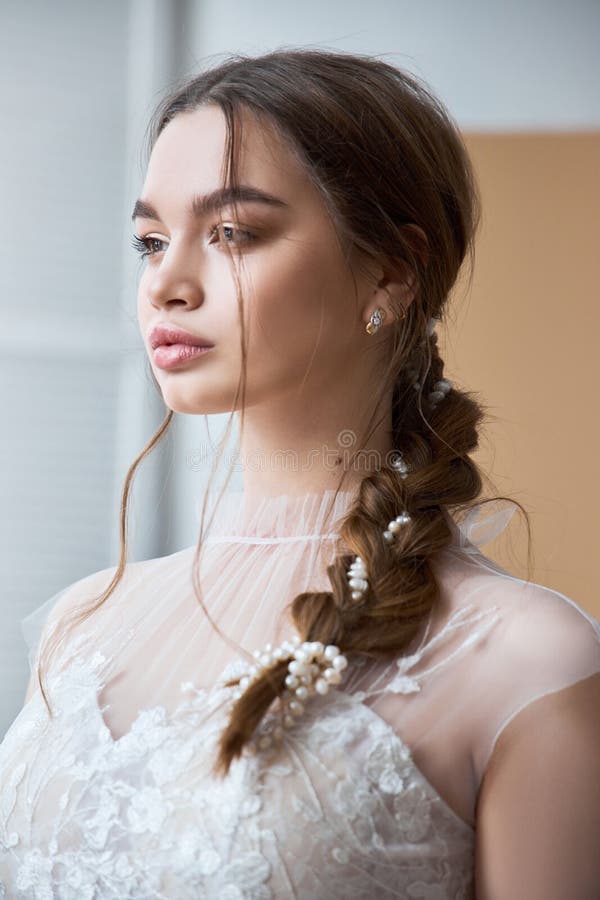 Brown-haired Girl in a Beautiful White Wedding Dress. a Woman Bride is ...