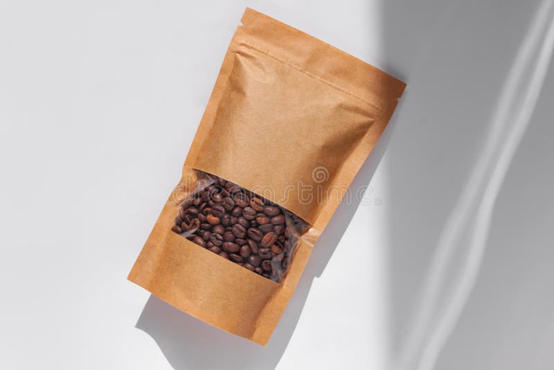 Download Brown Kraft Paper Pouch Bags With Coffee Beans Top View With Shadow Isolated On White Background Food Packaging Flat Lay Stock Image Image Of Clasp Herb 198830217