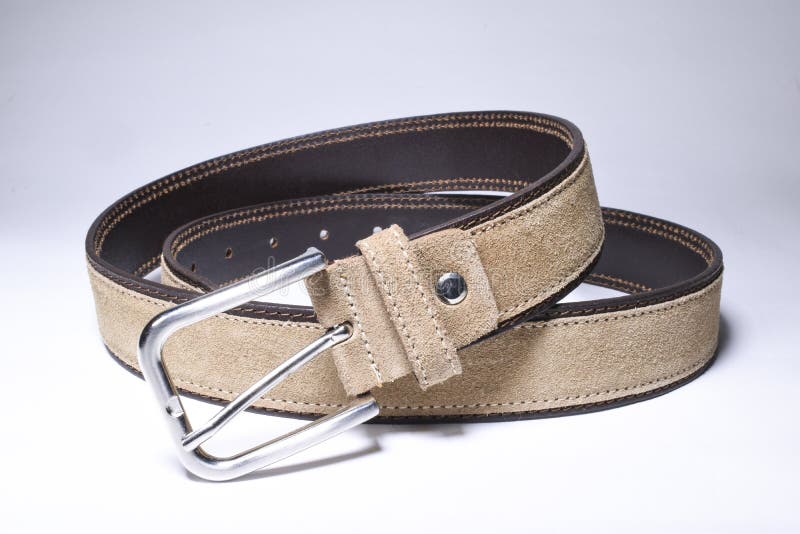 Brown leather belt with metal belt-buckle royalty free stock photo Brown leather belt with metal belt-buckle royalty free stock photo