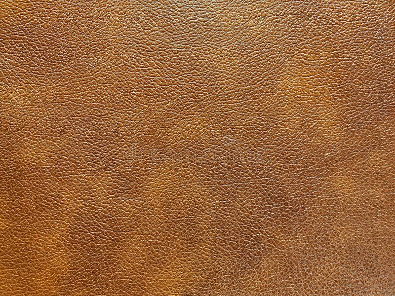 Brown leather that looks elegant and beautiful from an electric guitar case. Background or texture.