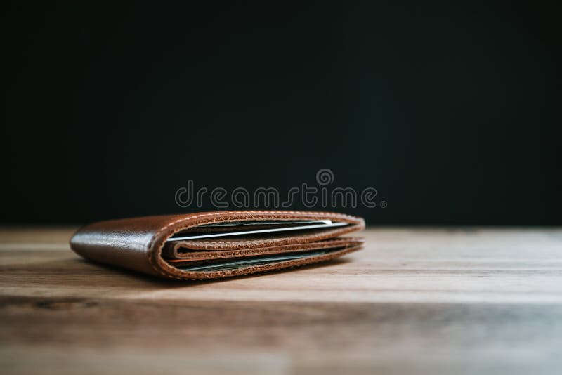 Brown Leather Wallet and Keys on a Wooden Table Stock Image - Image of ...